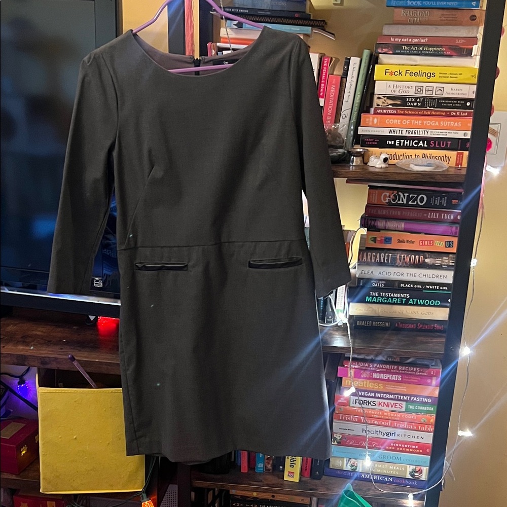 Elegant dark grey dress with black trim.